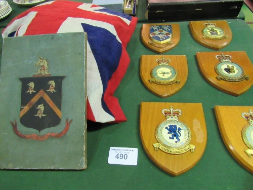 6 wooden wall plaques, RAF related & a qty of flags including R.N.L.I Coastguard flag. Estimate £