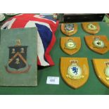 6 wooden wall plaques, RAF related & a qty of flags including R.N.L.I Coastguard flag. Estimate £