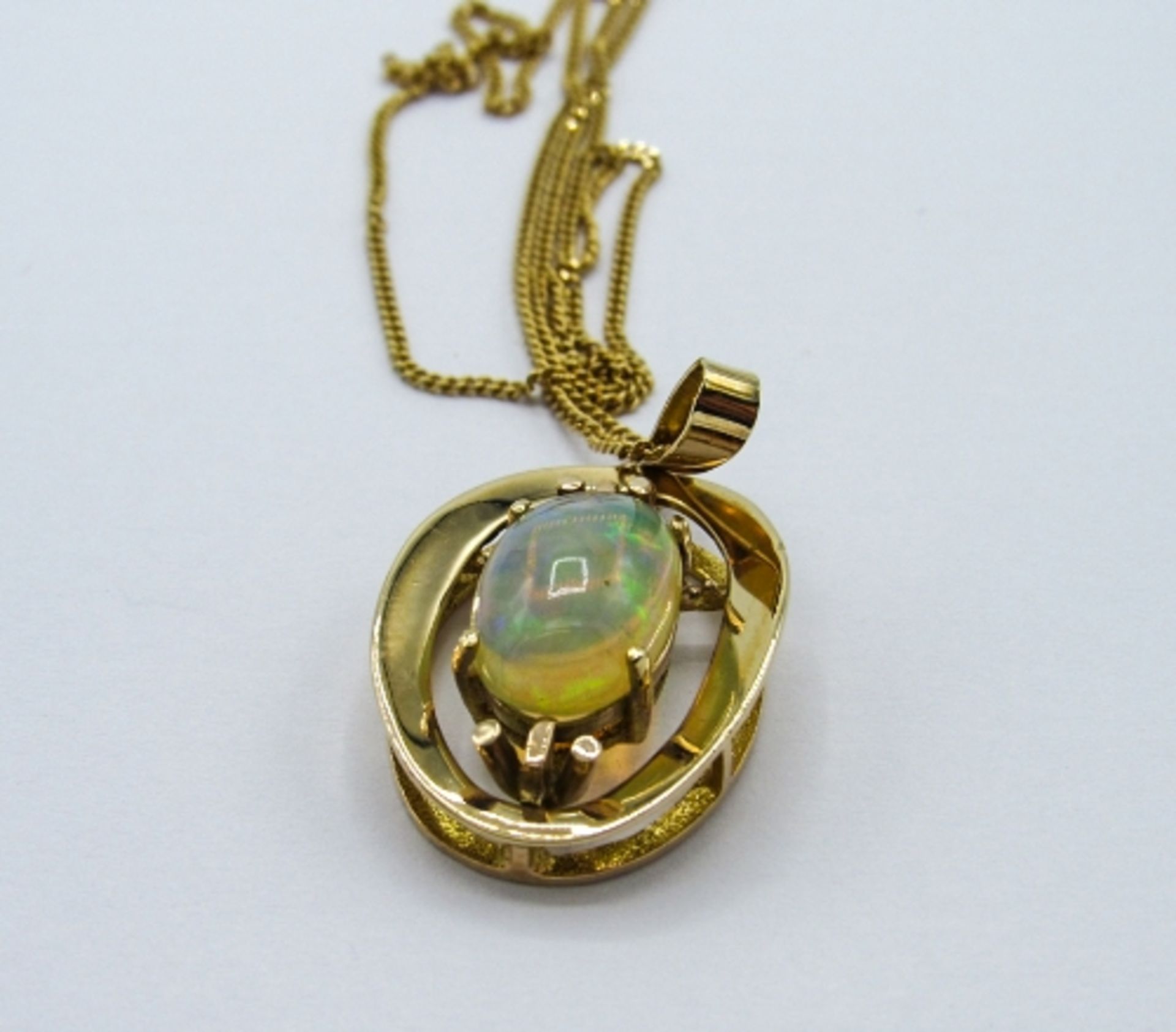 9ct gold opal pendant on a 9ct gold chain, weight 5.7gms. Estimate £325-350 - Image 2 of 3