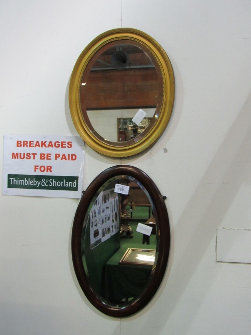 2 oval bevel edge mirrors - 1 with gilt frame & 1 mahogany. Estimate £10-20