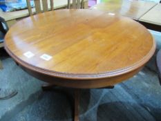 Circular dining table