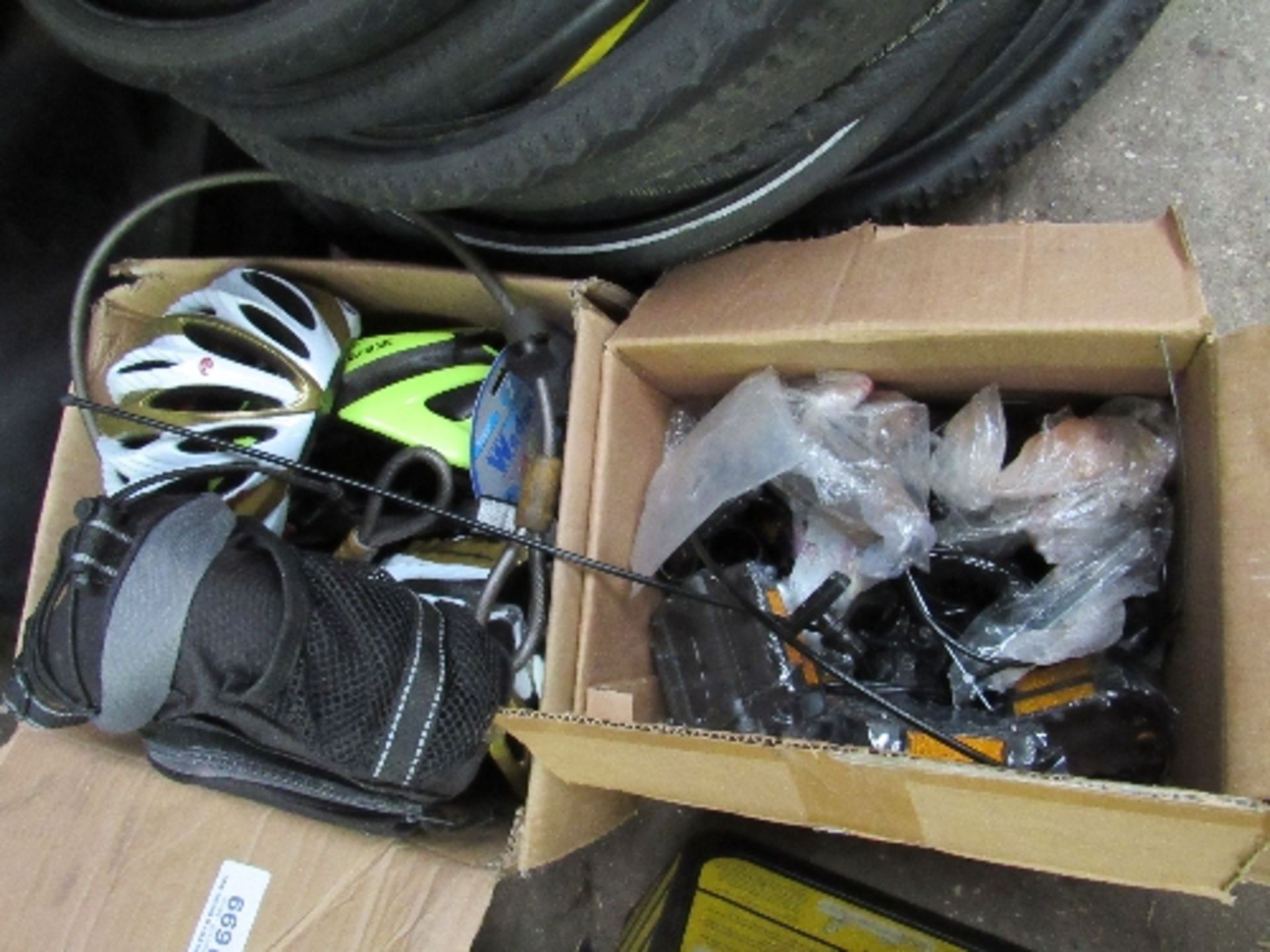 2 boxes of bike spares: helmets, pedals & brake cables