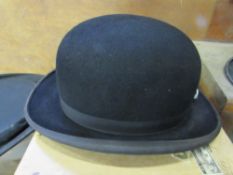 A black bowler hat by Scott & Co., 1 Old Bond Street, in its original cardboard box