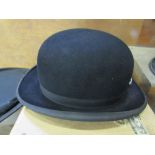 A black bowler hat by Scott & Co., 1 Old Bond Street, in its original cardboard box