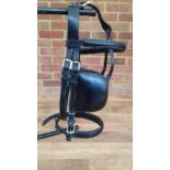 Black leather driving bridle