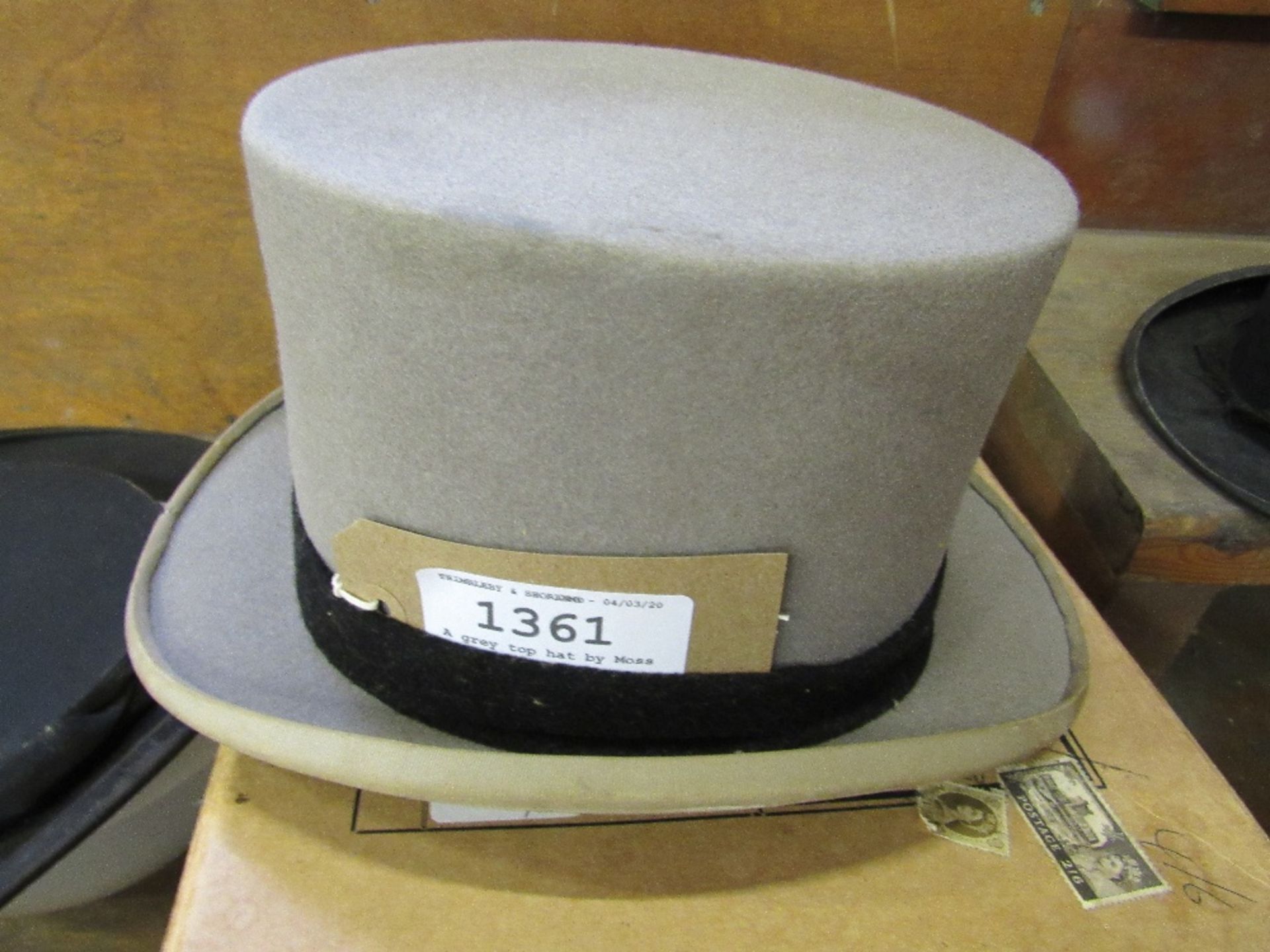 A grey top hat by Moss Bros