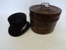 Tin top hat box with a top hat