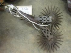 A pair of South American spurs with 5ins diameter rowels. Overall length 10ins (view in security