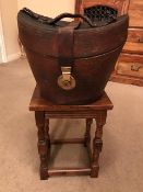 Brown leather top hat box by Collins & Fairbanks lined in silk, together with a black top hat, 19.