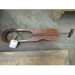 A very unusual mahogany boot jack with a long adjustable handle