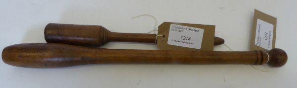 Two wooden balling guns