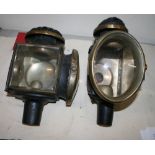 Pair of oval fronted carriage lamps with magnified lenses (view in security pen)