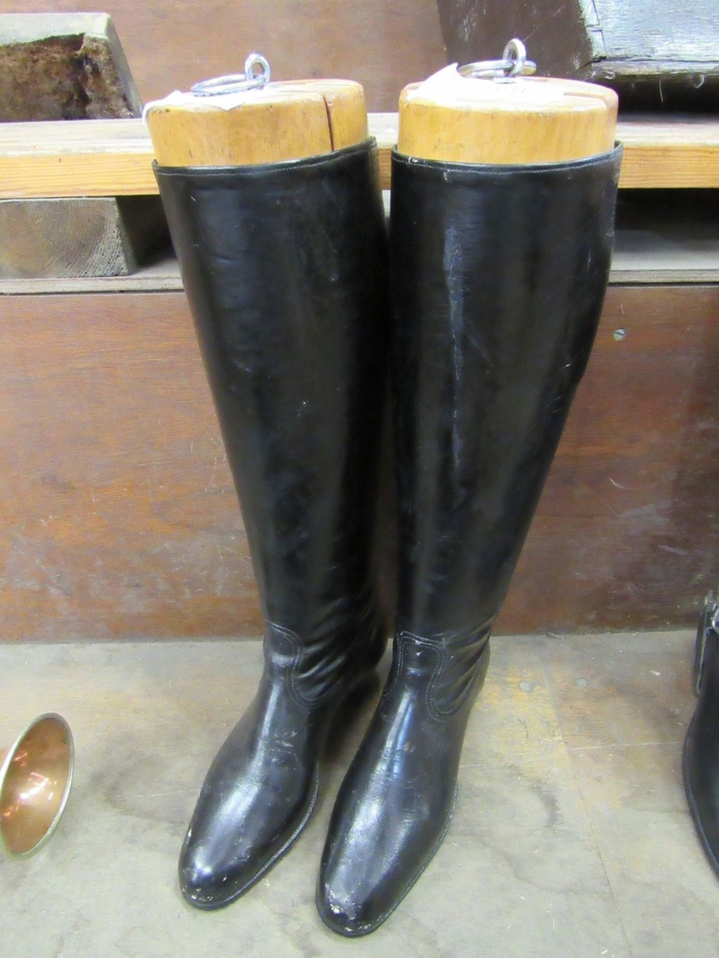 Pair of lady's side saddle boots with shaped heels and feet, complete with the original trees. In