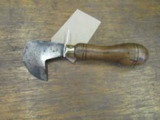 A saddler's head knife (view in security pen)