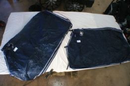 Pair of blue waterproof driving horse rugs