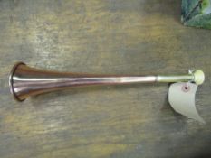 Copper hunt horn with brass ferrule and ivorine mouthpiece, made by Percival, St James Street,
