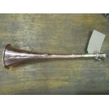 An unusual copper hunt horn with 2.5ins brass mouthpiece and ferrule in good condition (view in