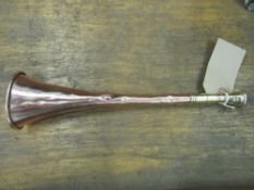 An unusual copper hunt horn with 2.5ins brass mouthpiece and ferrule in good condition (view in