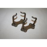 Two brass stable fork/broom holders