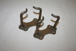 Two brass stable fork/broom holders