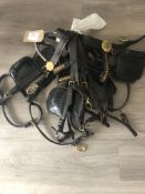 Five assorted leather driving bridles