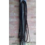 Pair of plaited brown leather reins, 14ft long