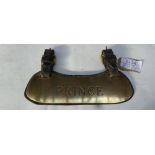 Brass name plate 'Prince' and on the other side 'sovereign' mounted on leather