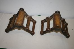 Two wooden-capped harness racks