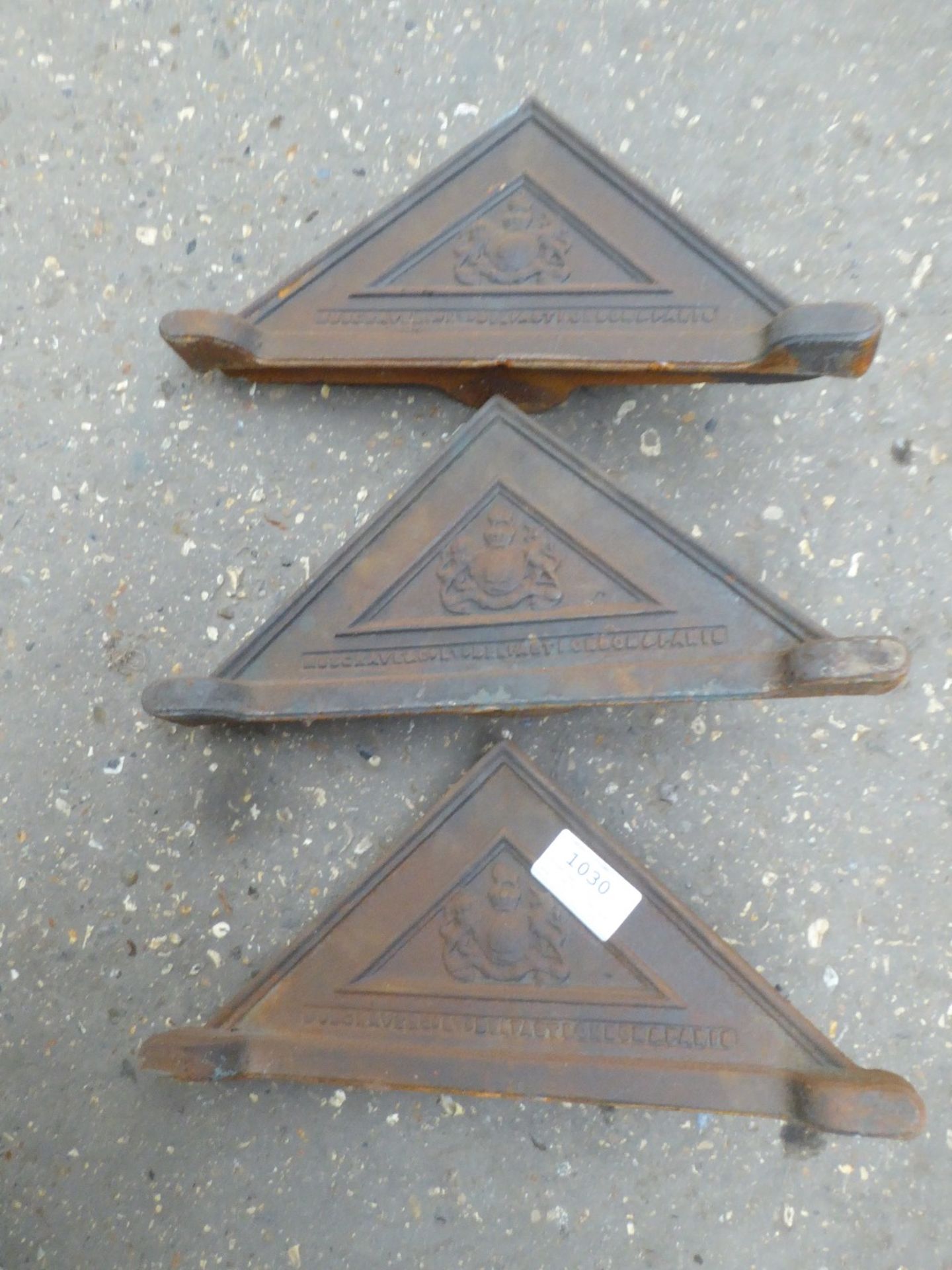 Three cast iron fittings for a harness box