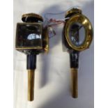 Pair of brass trap lamps with oval fronts