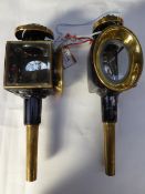 Pair of brass trap lamps with oval fronts