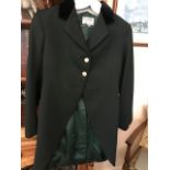 Three good quality green livery tail coats with brass buttons by Tom Brown of Eton, size 10-12,