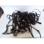 Box of miscellaneous harness pieces including an in-hand pony bridle, etc
