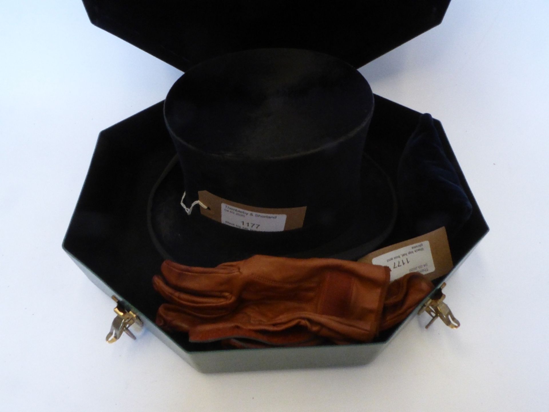 Black top hat by Hope Bros., London with a green hat box, plus a pair of brown leather gloves - Image 2 of 3