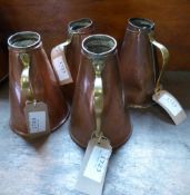 Four copper jugs