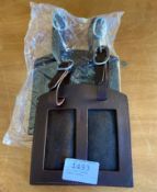 Two brown leather number holders