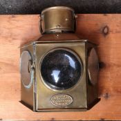 Brass foot board lamp with convex lens and an inscribed plate Davey & Co., London Ltd., 88 West
