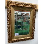 Gilt ornately framed wall mirror, 67 x 50cms. Estimate £10-20