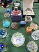 Collection of 19 glass paperweights and a stone egg. Estimate £50-70.