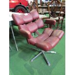 1970's style red vinyl armchair on chrome pedestal. Estimate £40-60.