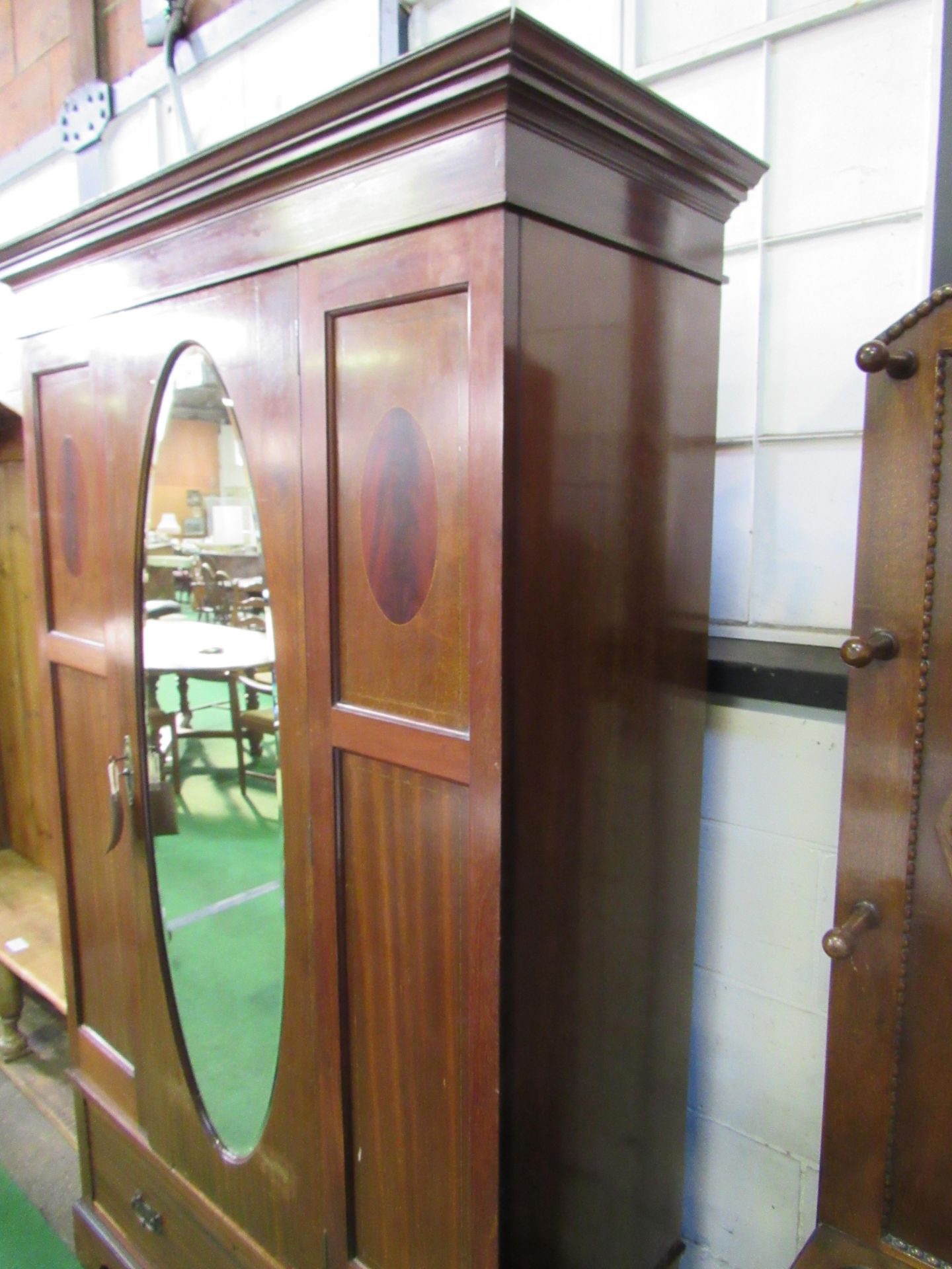 Edwardian mahogany wardrobe with oval door mirror & drawer to base, 116 x 45 x 204cms. Estimate £ - Image 3 of 5