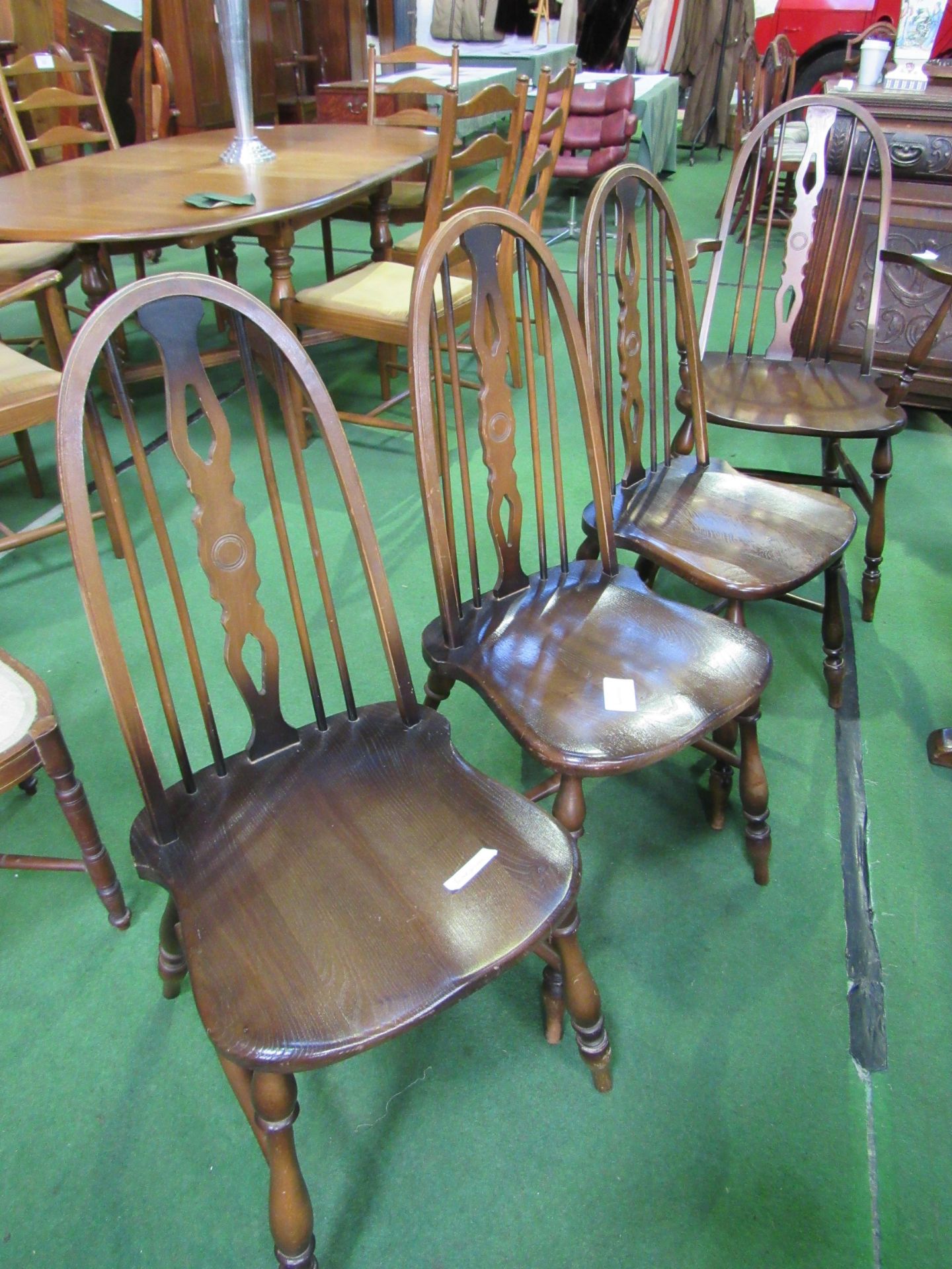 6 rail back shaped seat chairs and 2 matching carvers. Estimate £40-60.