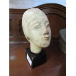 Egyptian sandstone carved burial head mounted on wood stand. Estimate £20-50.