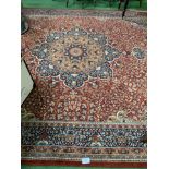 Red ground carpet 325 x 276cms. Estimate £50-80.