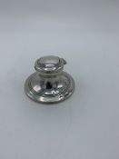 Silver inkwell, Birmingham 1909, complete with glass well, height 4cms. Estimate £30-40.