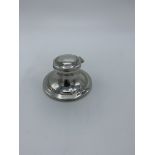 Silver inkwell, Birmingham 1909, complete with glass well, height 4cms. Estimate £30-40.