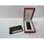 Original Cartier lighter in gold plate and black enamel with card in original ""Le Must de Cartier""