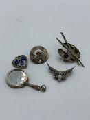 3 silver brooches & 2 silver pendants. Estimate £10-20.