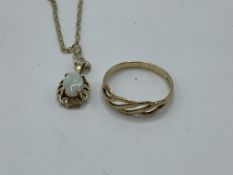 9ct gold band ring with open work to front, size K, weight 1.0gm. 9ct gold and opal pendant on a 9ct