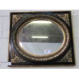 Ebonised oval mirror with gold foliage in a square frame with gold spandrels. Estimate £50-60.
